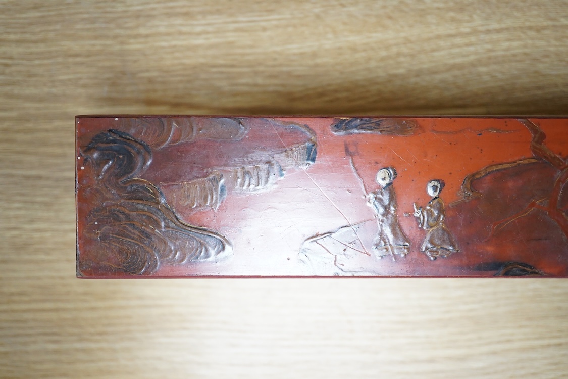 A Chinese red lacquered stand, 39cm wide